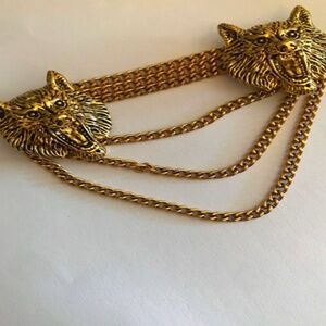 Gold wolf cloak clasp